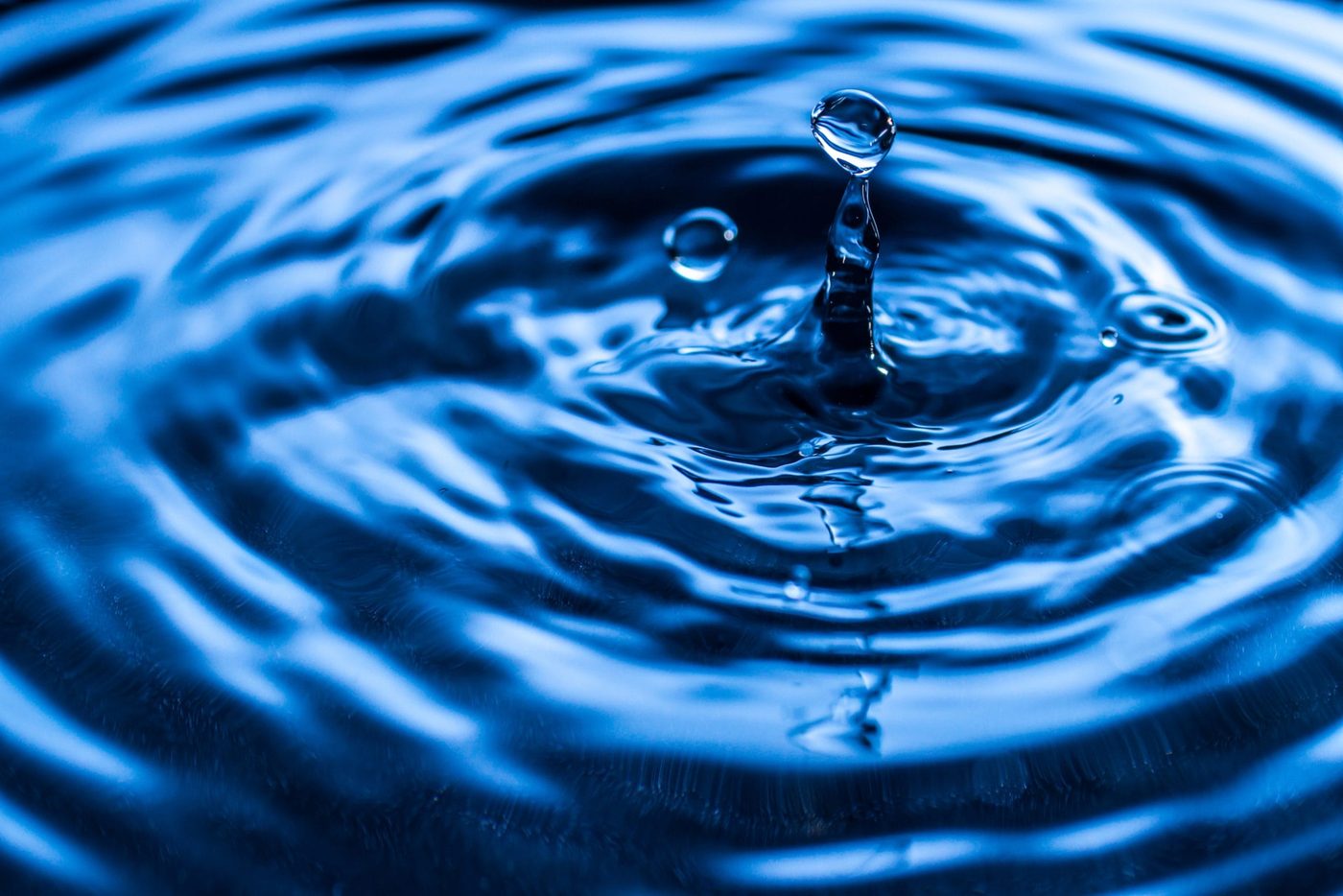 - color - water drop splash in glass blue colored 1 scaled - branding