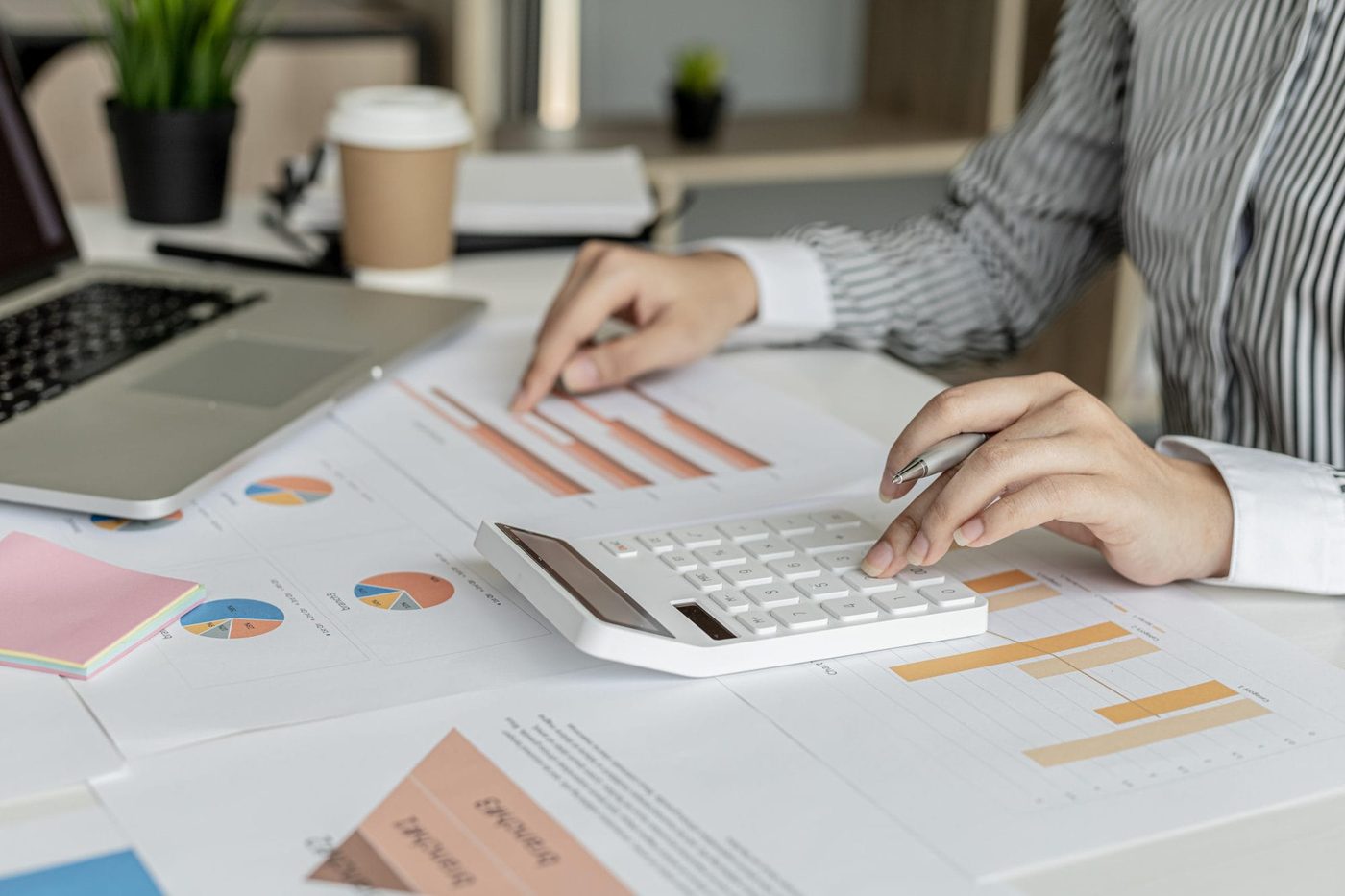 - roi - corporate financier is checking financial documents correctness financial statements she is checking numbers documents using calculator calculate finance concept 1 e1725466515406 - ui/ux