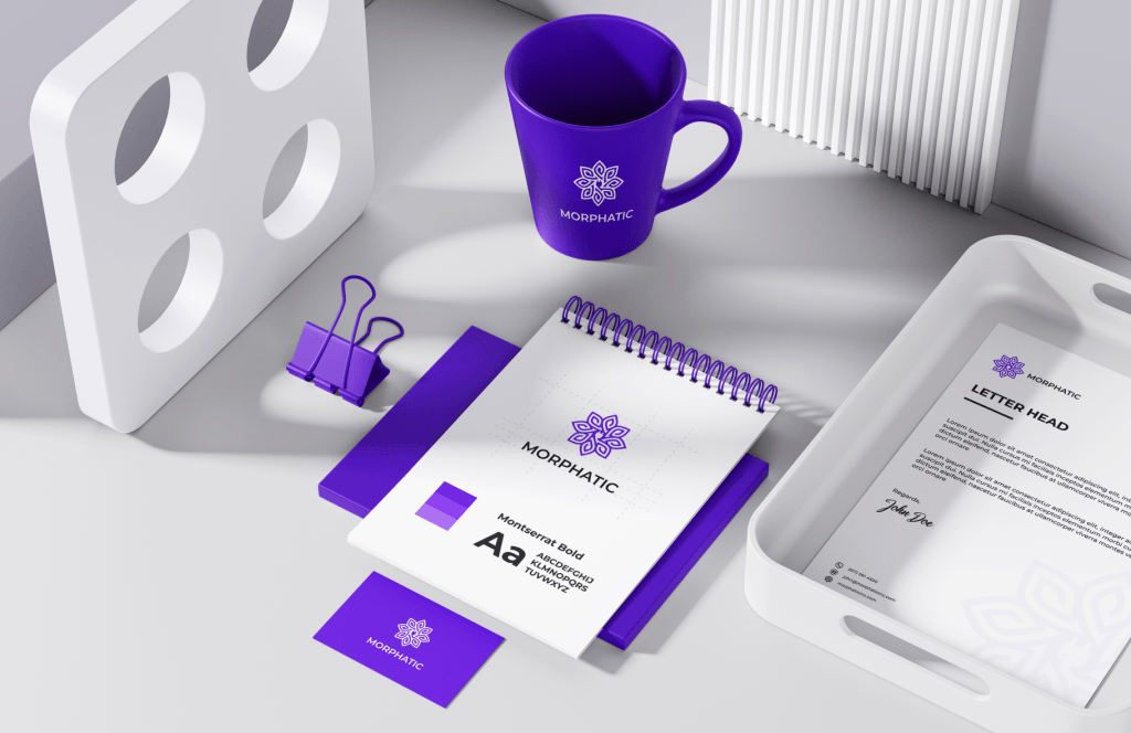 A purple mug and notepad on a white surface