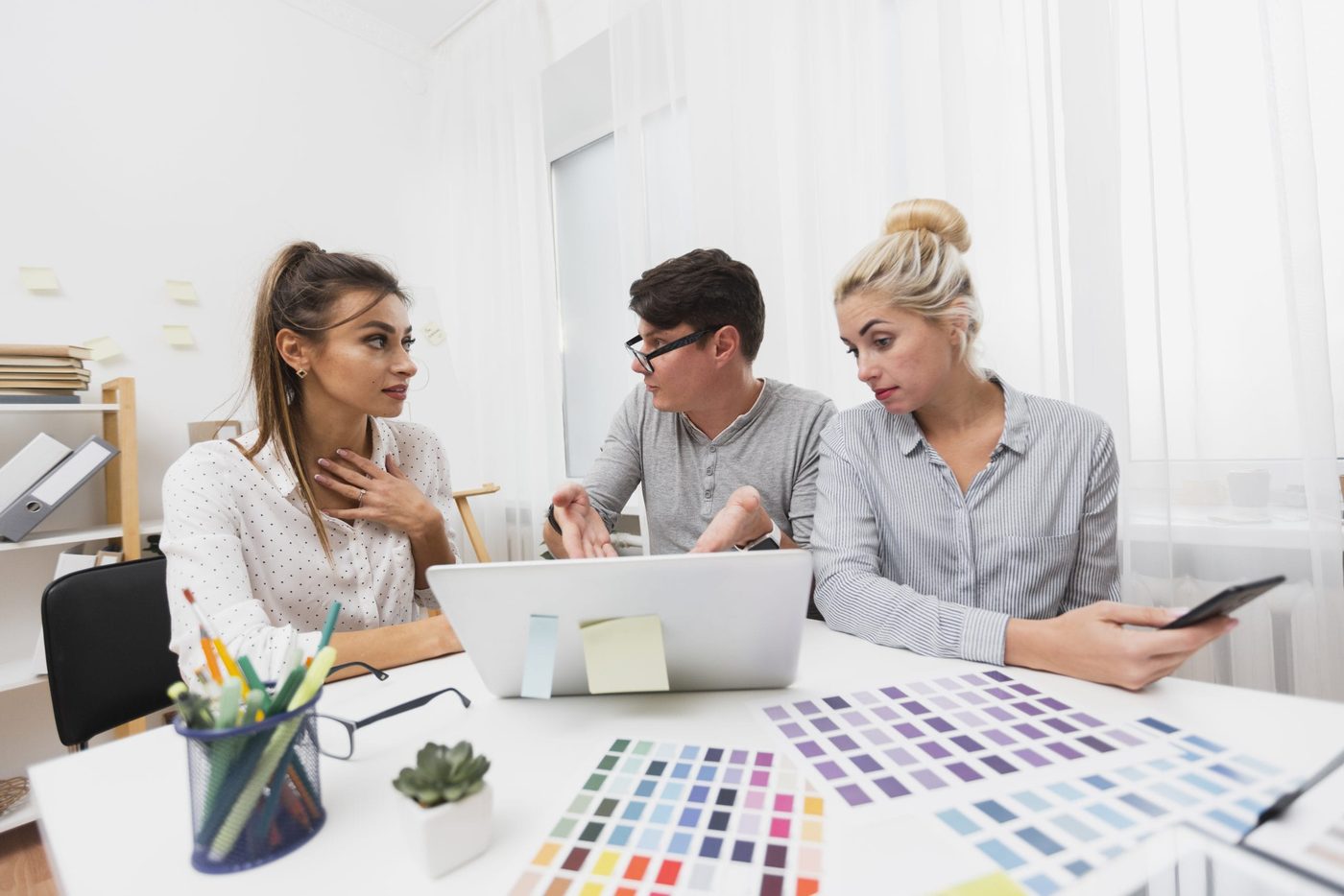Designers discussing ui/ux for a mobile application