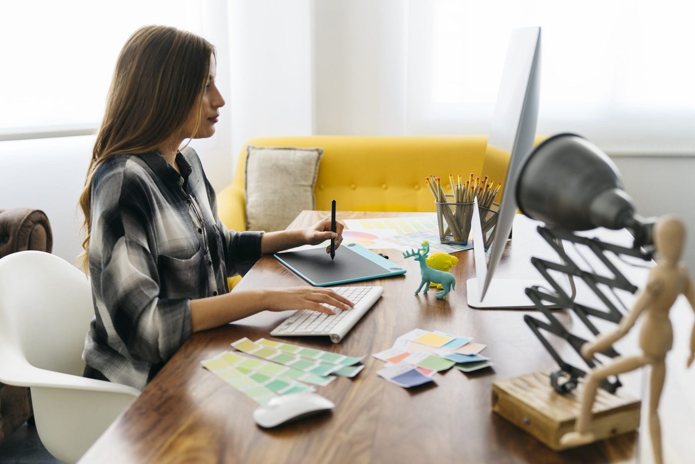 - in-office - side view of graphic designer scaled - ui/ux