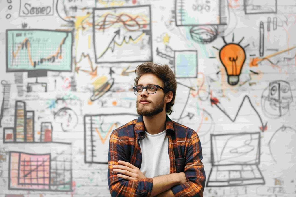 - clics - creative marketer contemplating innovative strategies amidst idea doodles 1 1 - web design